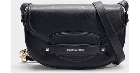 michael kors cary medium leather saddle bag|Michael Kors quilted black bag.